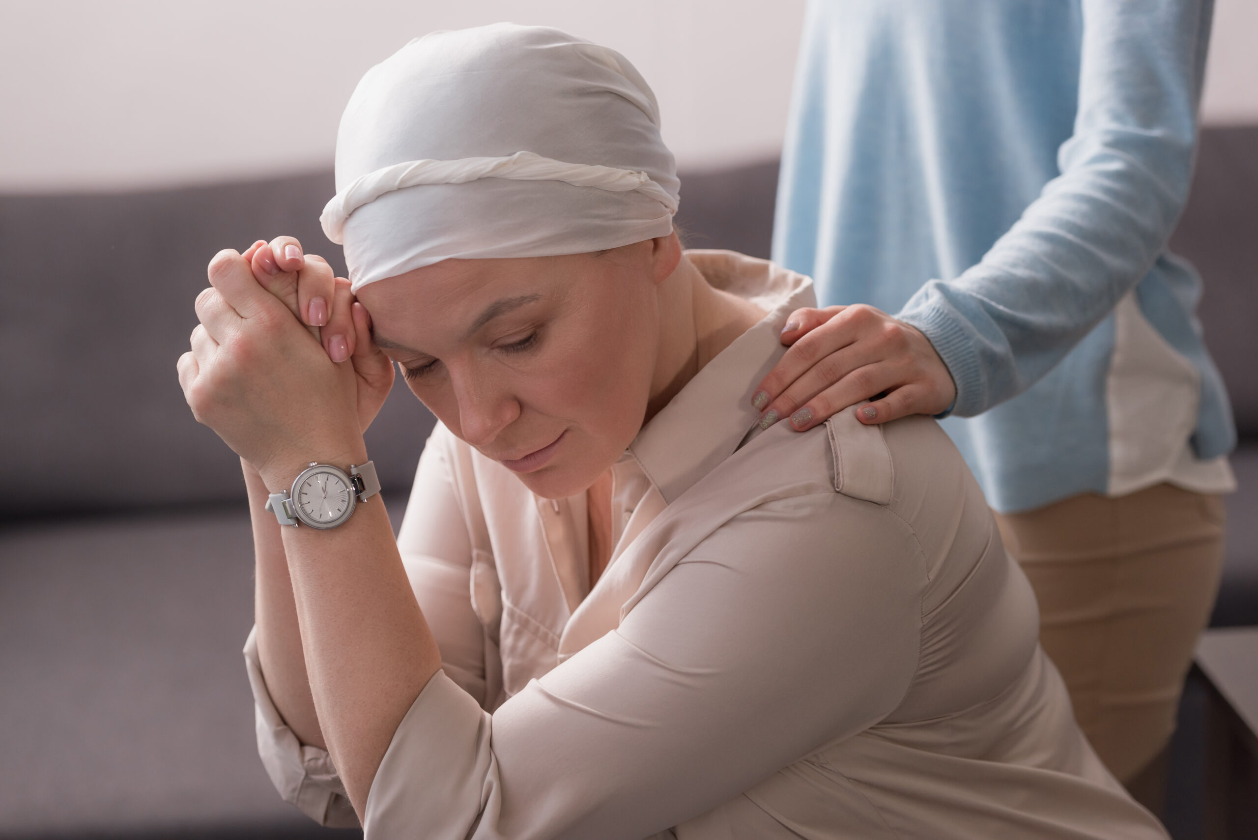 cropped shot of woman supporting sick mature mother in kerchief